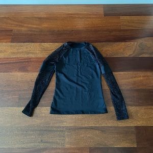 black long sleeve shirt with sparkles on the sleeves